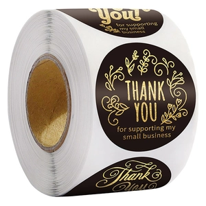Roll of black and gold round Thank You stickers with elegant gold foil plant patterns