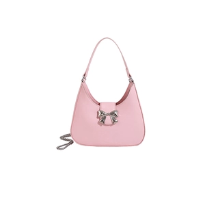 Chic pink shoulder bag with silver metal bow and chain strap on white background