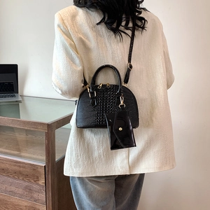 Fashionable black crocodile embossed shell bag with gold hardware and small hanging pouch