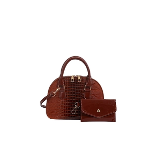 Brown crocodile embossed shell handbag set with matching envelope wallet and gold accents