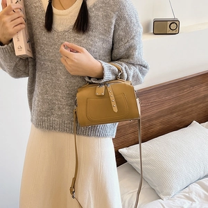 Vintage Boston pillow handbag in brown faux leather with rivet buckle details