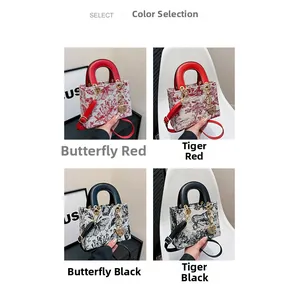 Detail view of luxury embroidered tote bags with animal patterns and heart charms
