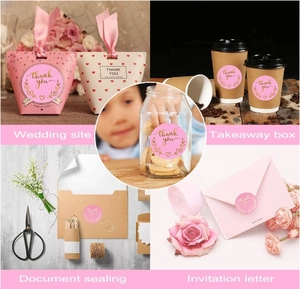 Pink round thank you labels with gold foil floral wreath for gift packaging and favors