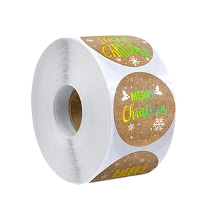 Holographic Merry Christmas kraft paper stickers in a large roll for gift packaging