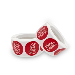 Roll of red Merry Christmas decorative stickers with white stars for holiday gift packaging
