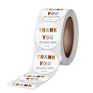Roll of white round thank you for your order stickers with colorful gradient text