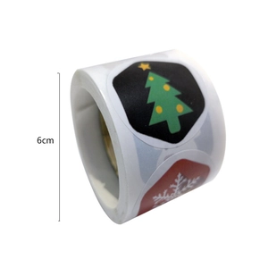 Christmas roll stickers featuring Santa and snowflake designs for holiday gift packaging