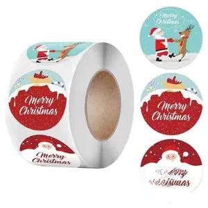 Close-up of Santa and reindeer Christmas envelope seal stickers in a roll