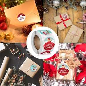 Roll of Merry Christmas envelope seal stickers with Santa Claus and reindeer designs