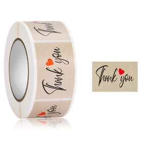 Roll of kraft paper Thank You stickers with black script and red heart for business