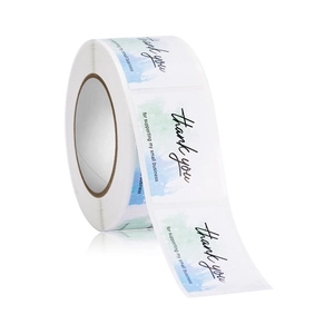 Macro shot of rectangular watercolor thank you stickers for small business packaging