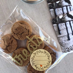 Kraft paper olive branch stickers on transparent cookie bags with gold treats text