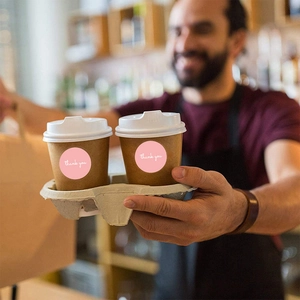 Pink thank you sealing stickers on coffee cup for creative business product packaging