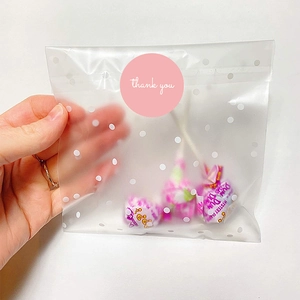 Pink Thank You sticker on translucent polka dot self-sealing food packaging bag