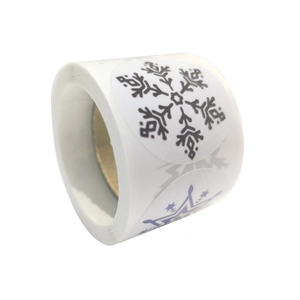 Christmas snowflake self-adhesive stickers on a roll for gift wrapping and decoration
