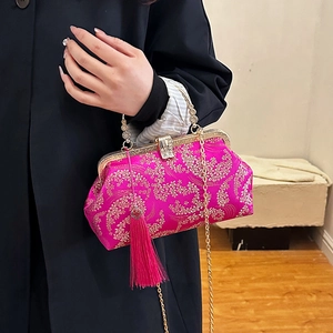 Pink Chinese embroidery handbag with golden floral patterns and elegant tassel