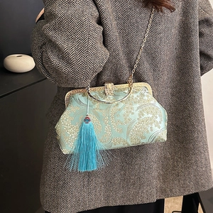 Elegant mint green embroidered Chinese style evening bag with floral jacquard and blue tassel