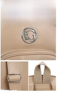 Detail of adjustable leather straps and golden metal G-logo on beige fashion backpack