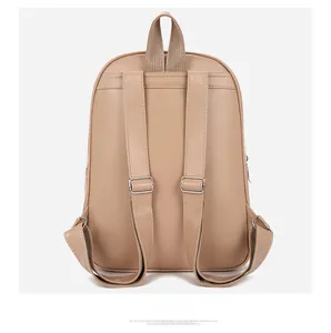 Detailed back view of minimalist apricot leather backpack with adjustable silver buckles
