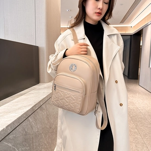 Chic beige quilted leather backpack for women with stylish geometric stitching and metal logo