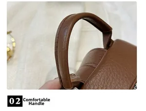 Detailed close-up of soft brown lychee grain leather handle on stylish backpack