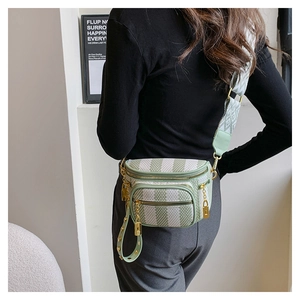 Crossbody chest bag with multi-zipper compartments and ethnic style wide shoulder strap