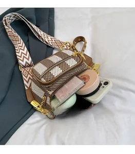 Top view of a checkerboard chest bag showing spacious interior and golden zippers