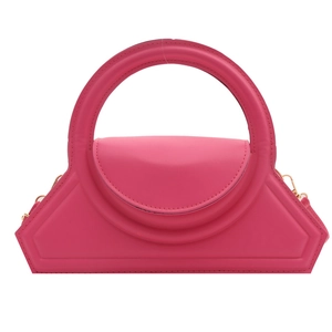 Fuchsia geometric handbag with large circular handle and smooth faux leather finish