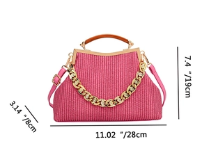 Detailed view of rose pink woven bag with gold chain and dimensions 11.02 x 7.4 x 3.14 inches