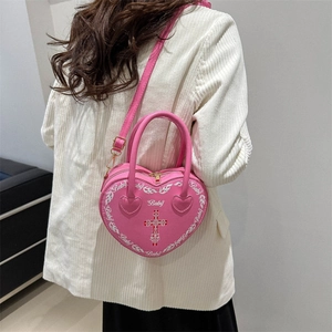 Pink heart-shaped punk handbag with white flame pattern and red cross design