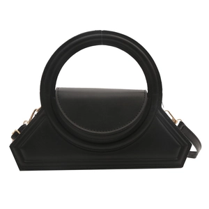 Minimalist black geometric handbag with curved handle and detachable shoulder strap