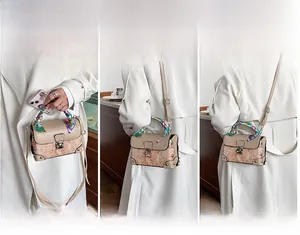 Detailed view of vintage embroidered box bag showing handbag, shoulder, and crossbody styles