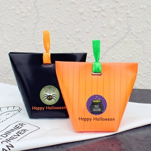 Halloween gift bags with ribbon handles featuring spider and happy halloween graphics