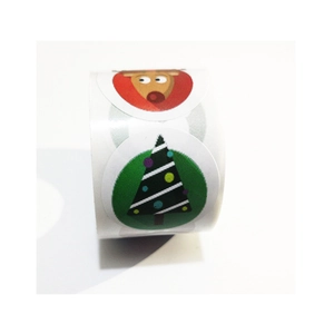 Rotolo di adesivi natalizi con renne e alberi per decorare confezioni regalo