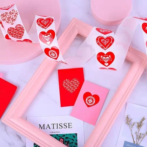 Valentine's Day heart sticker rolls with pink gift cards for romantic decorations