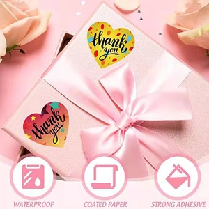 Heart-shaped Thank You stickers with colorful polka dots on gift box packaging