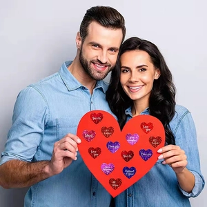 Glitter heart stickers for Valentine's Day with love messages held by a happy couple