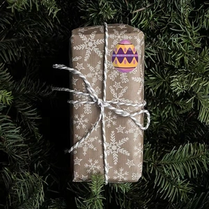 Kraft paper Easter gift box with white snowflake patterns and colorful egg sticker