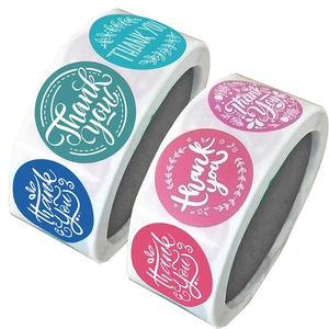 Two rolls of colorful floral Thank You stickers for gift packaging and envelope sealing