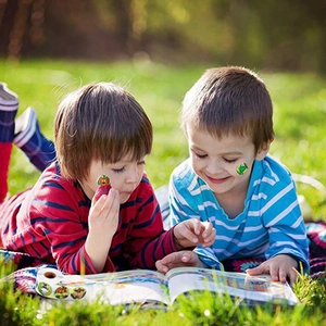 Cartoon animal stickers roll for kids featuring lions and frogs in outdoor play scene