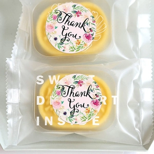 Pastry packaging with floral Thank You stickers and Sweet Dessert Inside text