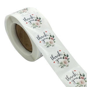 Floral heart thank you stickers on a roll with pink roses and elegant cursive text