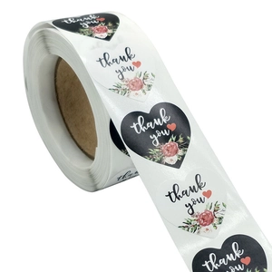 Roll of heart-shaped Thank You stickers with floral patterns for gift packaging