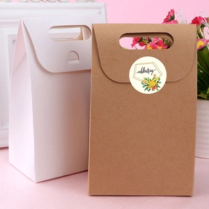 Premium cardboard gift bags in white and kraft brown with floral celebrating stickers