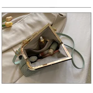 Open view of shell bag showing spacious interior with pockets and skincare items