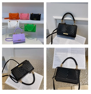 Detailed view of mini crossbody bags with woven handles and quilted V-pattern texture