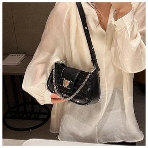 Black stone pattern shoulder bag detail, chic metal chain and heart buckle accent.