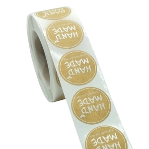 Brown kraft paper round stickers with Hand Made and Especially for You white text roll
