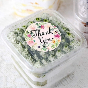 Floral Thank You round stickers for gift packaging and envelope sealing on clear cake box