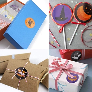 Roll of Halloween stickers with pumpkin and ghost patterns for gift packaging seal
